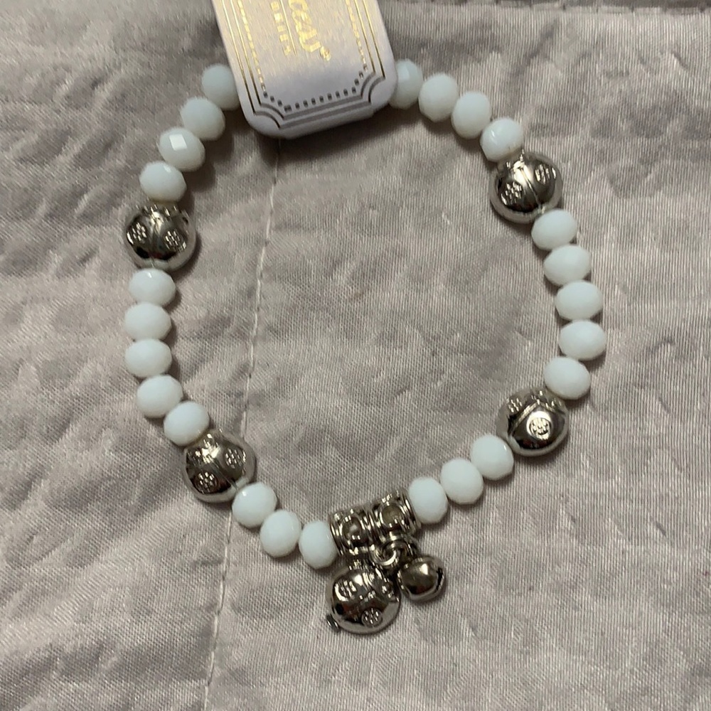 5/$25 NWT white stone stretchy bracelet w/sweet silver ladybug charms/beads.